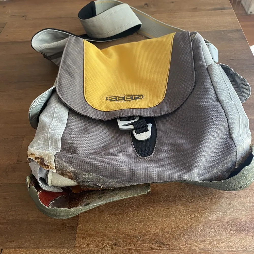Before: a Keen bag with the front panel torn open